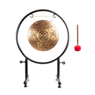 Cosmic Mandala Gong displayed with its red-tipped wooden mallet.