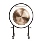 Pure Bronze Harmony Gong on a black metal stand.