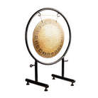 Side angle view of the Sacred Flower of Life Gong on its sturdy black stand.