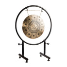 Side angle view of the Timeless Kalachakra Gong on its black stand.